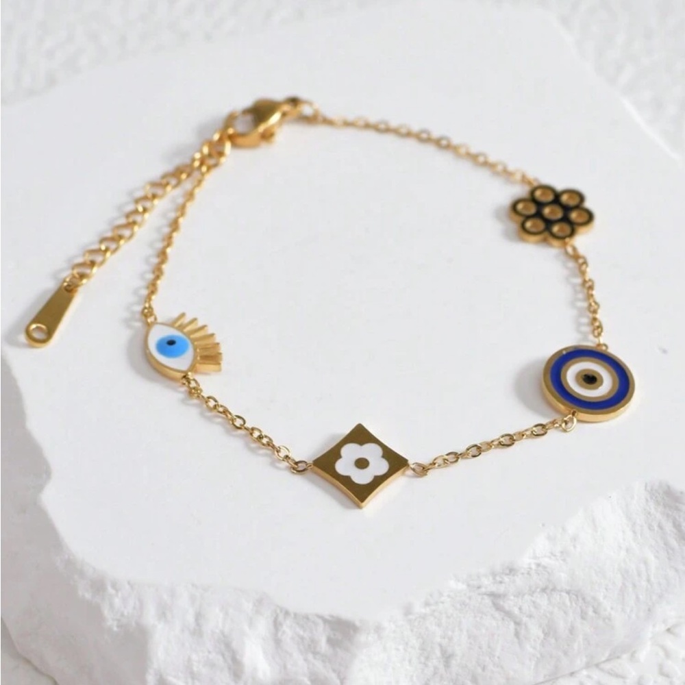 Gold plated stainless steel flower and eye bracelet